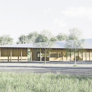 Altbekanntes mit neuem Eingang - Der Blick auf das neue Eingangsgebäude vom neuen Parkplatz aus. Dieser wird künftig die Parkplatzsituation beim Oberstufenschulhaus entschärfen. Bild: pd